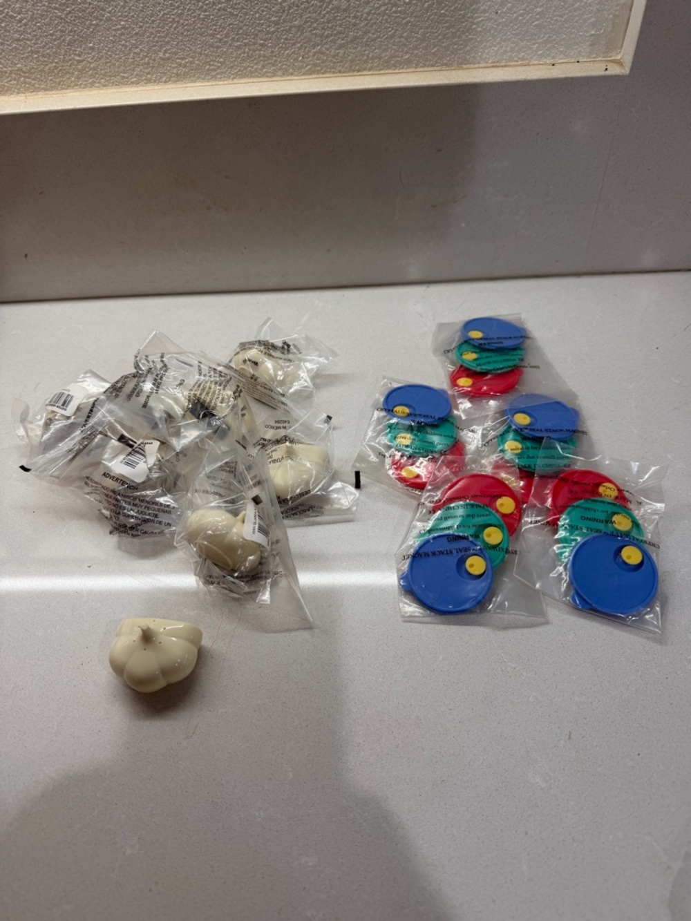 Tupperware Multi-Color Lid Seals and White garlic keeper magnets new.